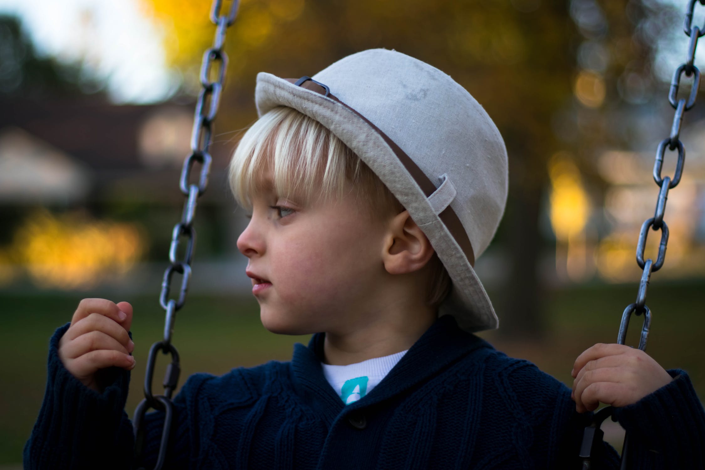 Child playing on swing