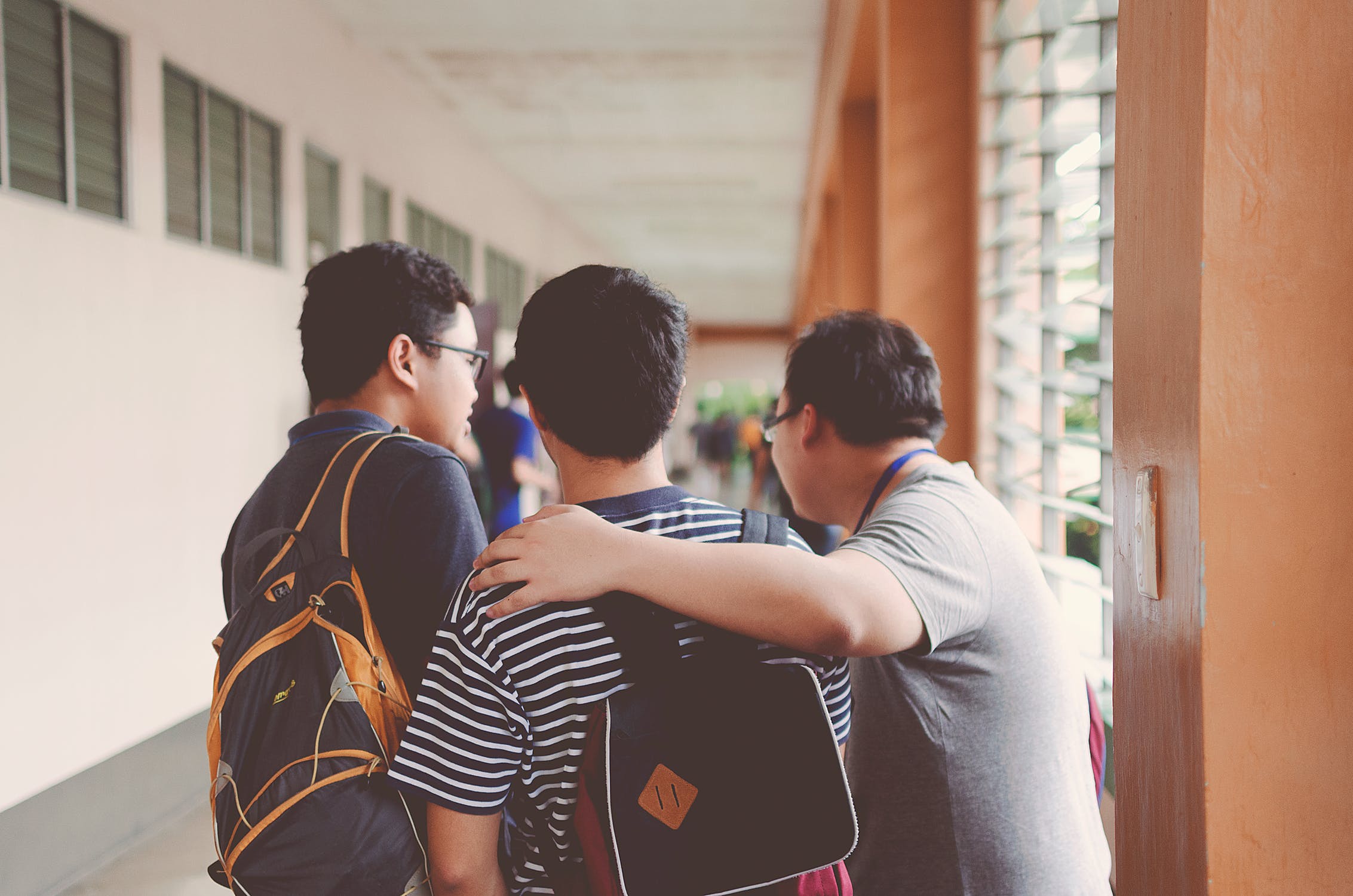 Head teacher showing students where to go