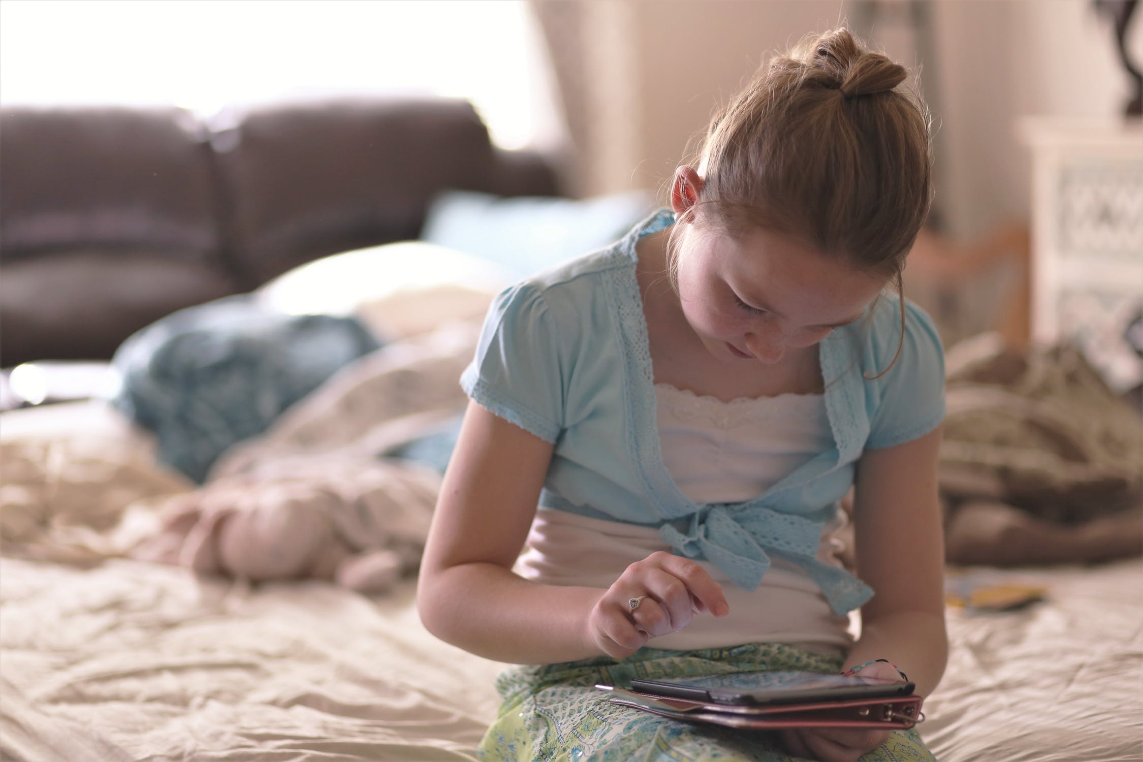 Girl playing on iPad