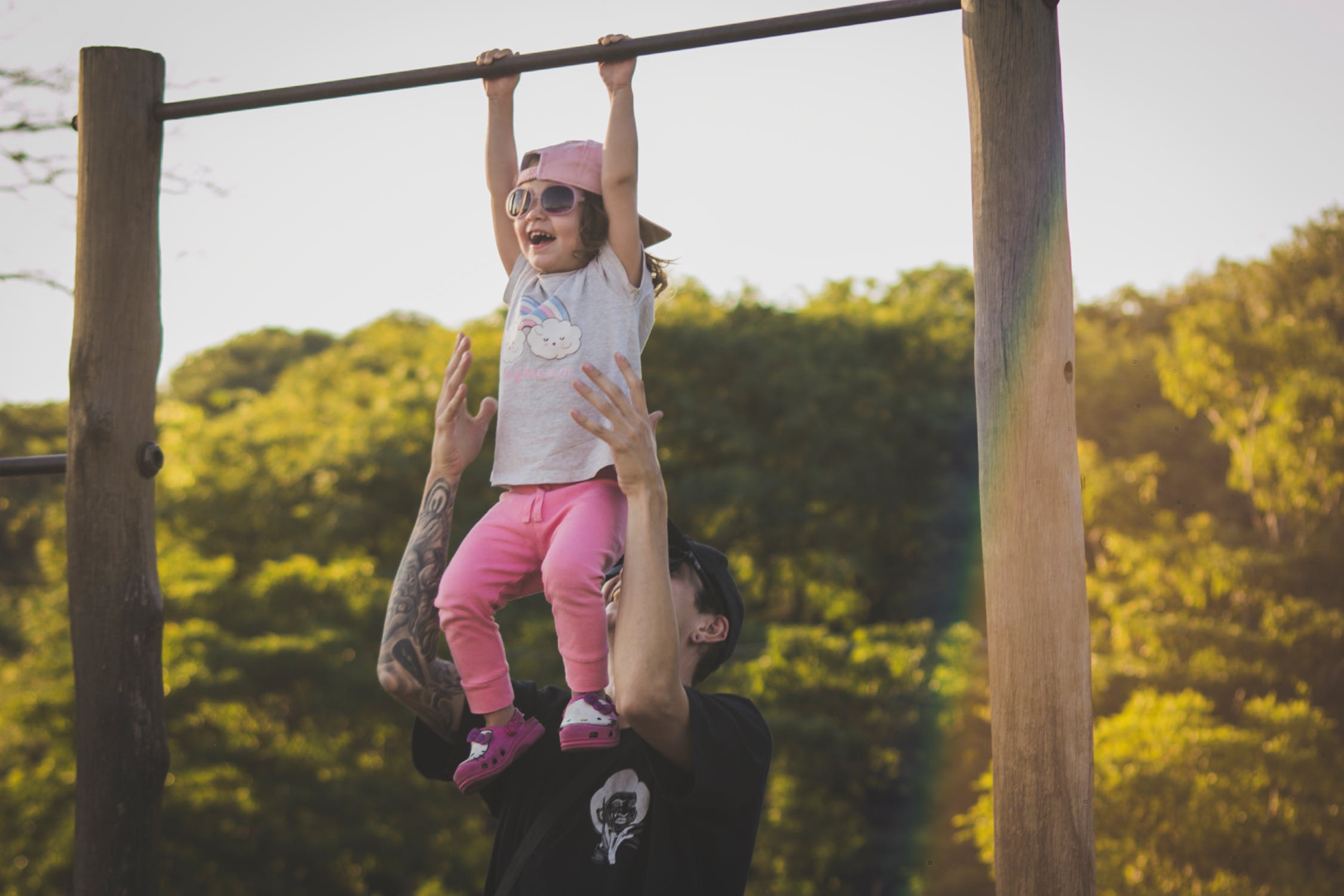 Girl playing on monkey bars