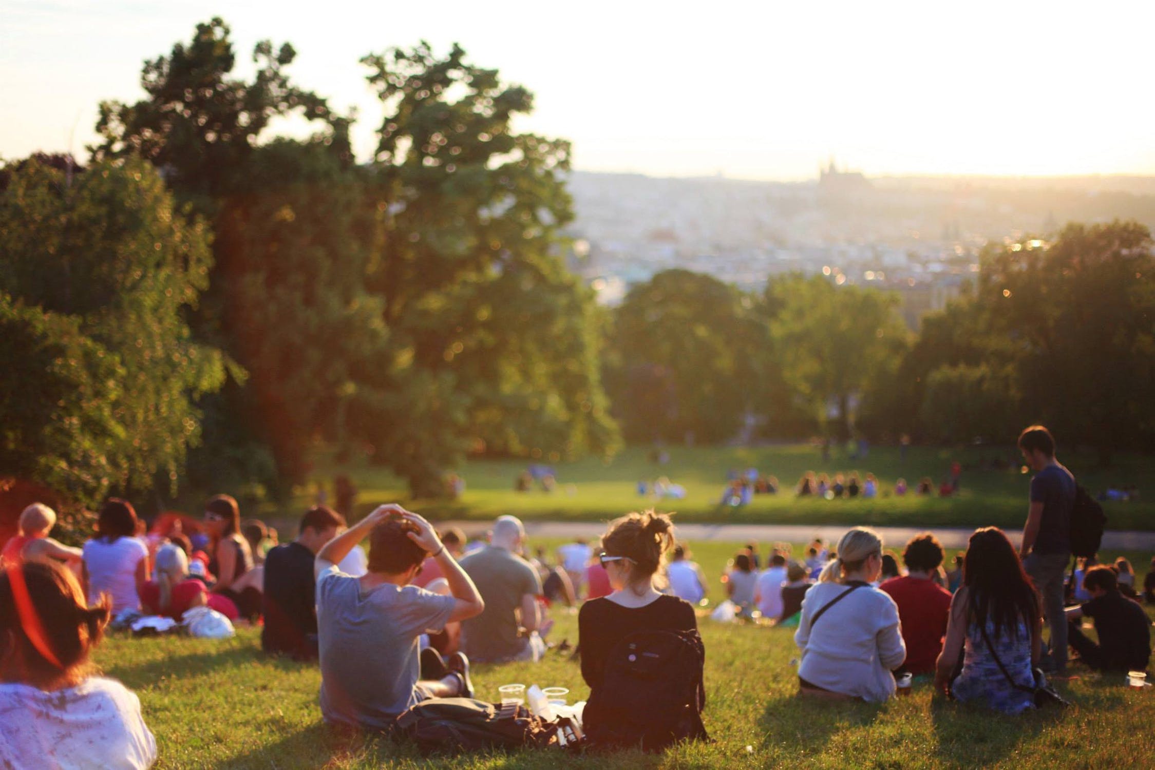 People sitting in the sunshine in the park