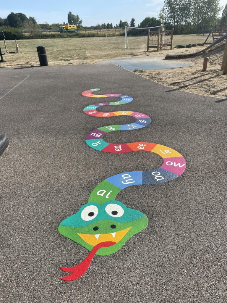 a rainbow coloured phonics snake playground marking