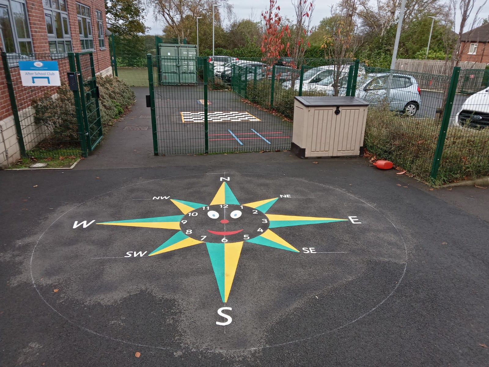 green and yellow compass playground marking