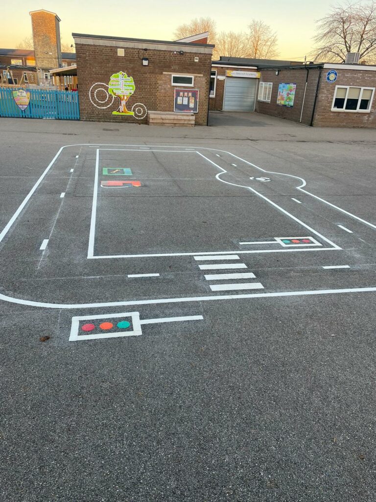 roadway playground markings, buildings behind