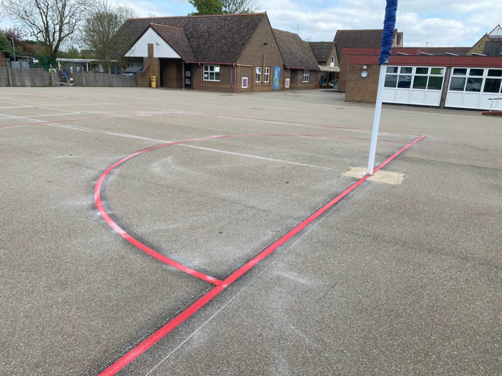 netball court playground markings, point of view from behind goal end